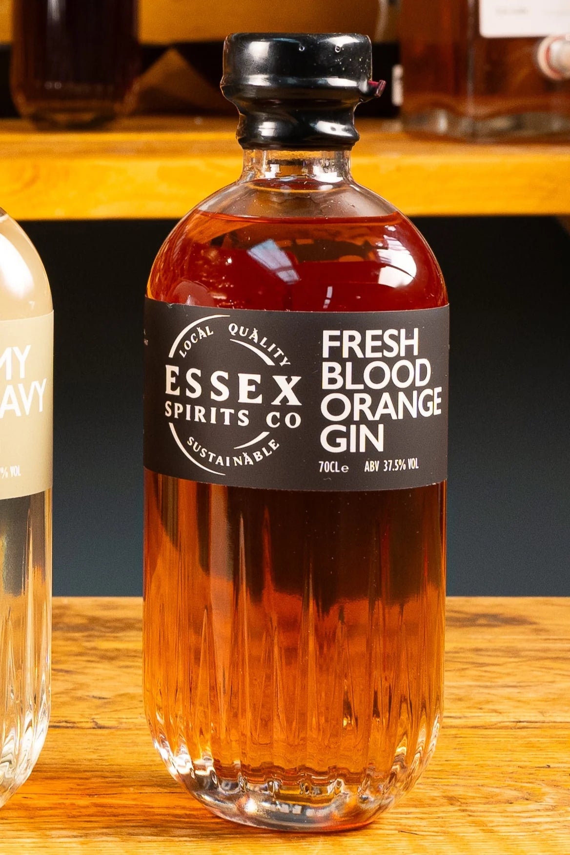Bottle of Essex Spirits Co Fresh Blood Orange Gin on a wooden surface available at Stort Valley Gifting