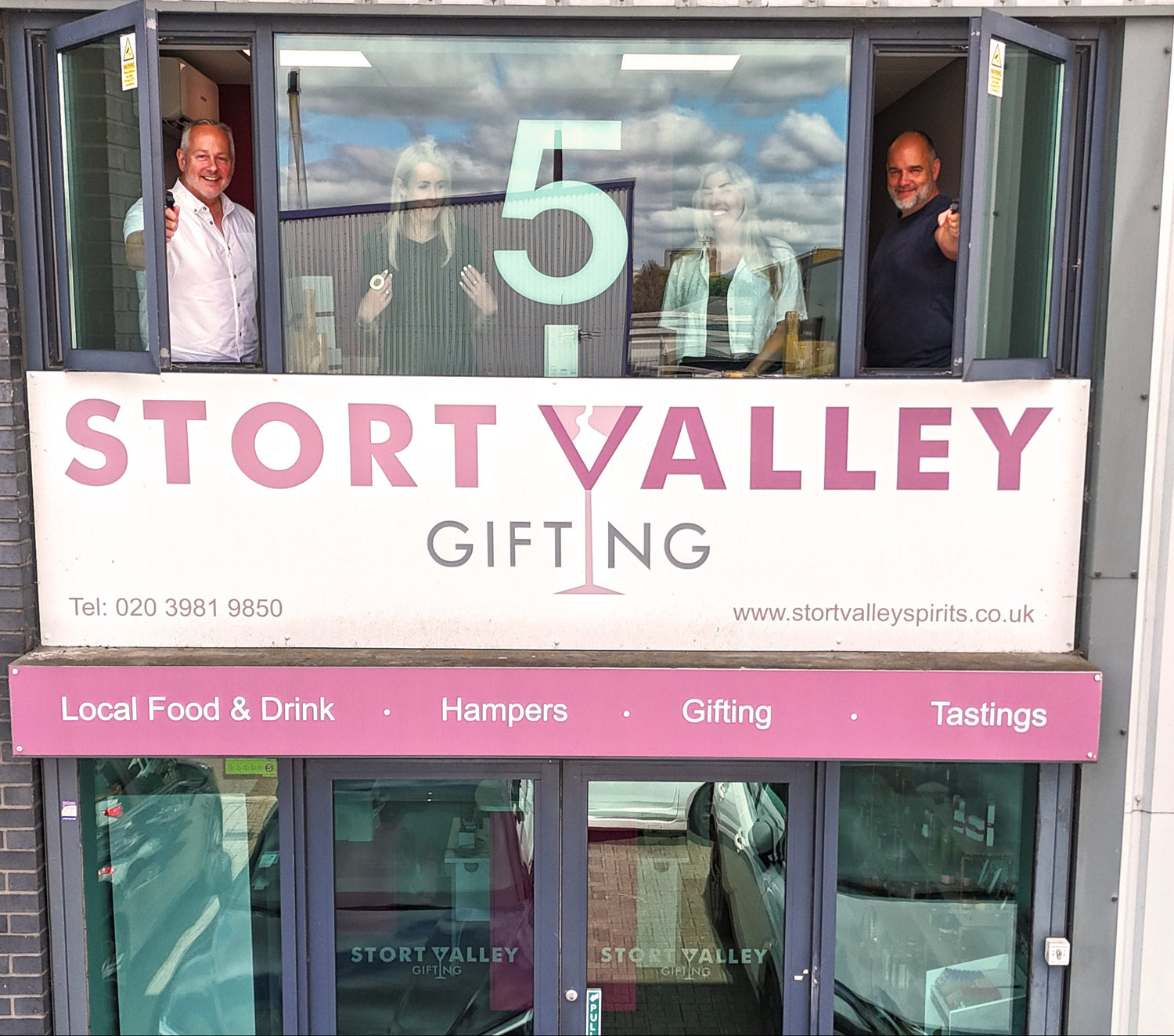 Storefront of the Hamper Hub with 'Stort Valley Gifting' sign and people inside