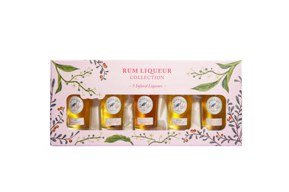 Set of rum liqueur bottles in a decorative box with floral designs on a white background available at Stort Valley Gifting