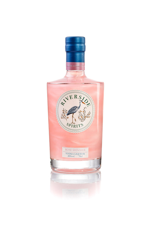 Pink bottle of Riverside Spirits Rose Vodka Liqueur on a white background