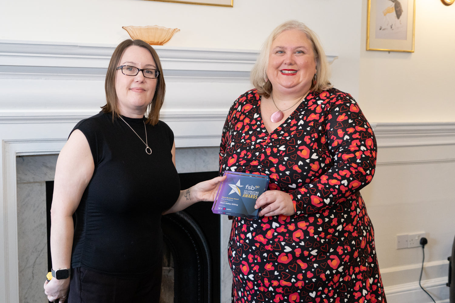 Emma Robson owner of Stort Valley Gifting receiving an award for business