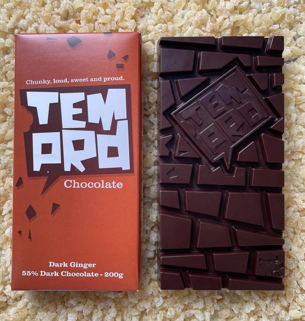 Temprd Dark ginger and dark chocolate bar with packaging on a textured surface available from Stort Valley Gifting