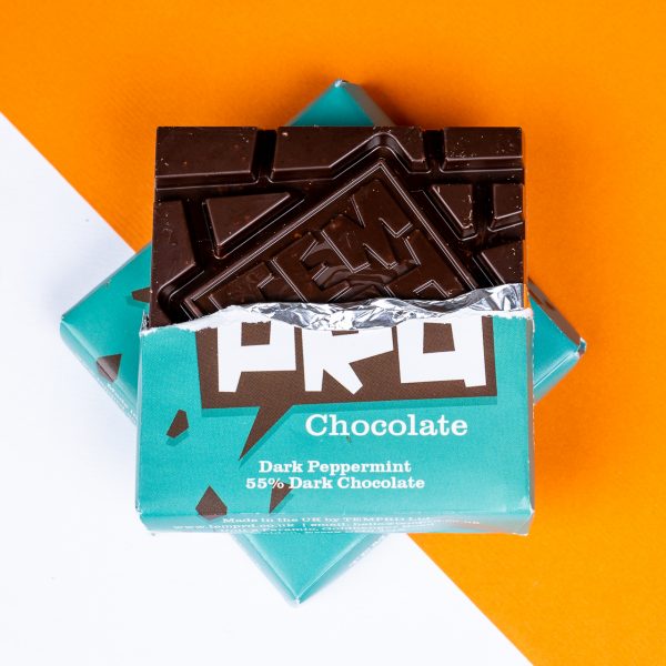 Box of Temprd dark peppermint chocolate bars with turquoise packaging on a white and orange background available from Stort Valley Gifting