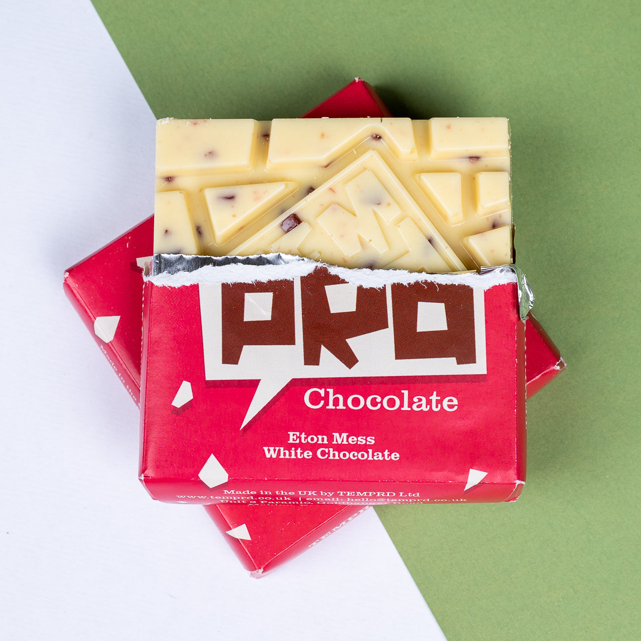 Red Temprd Eton Mess white chocolate bar on a green and white background available from Stort Valley Gifting
