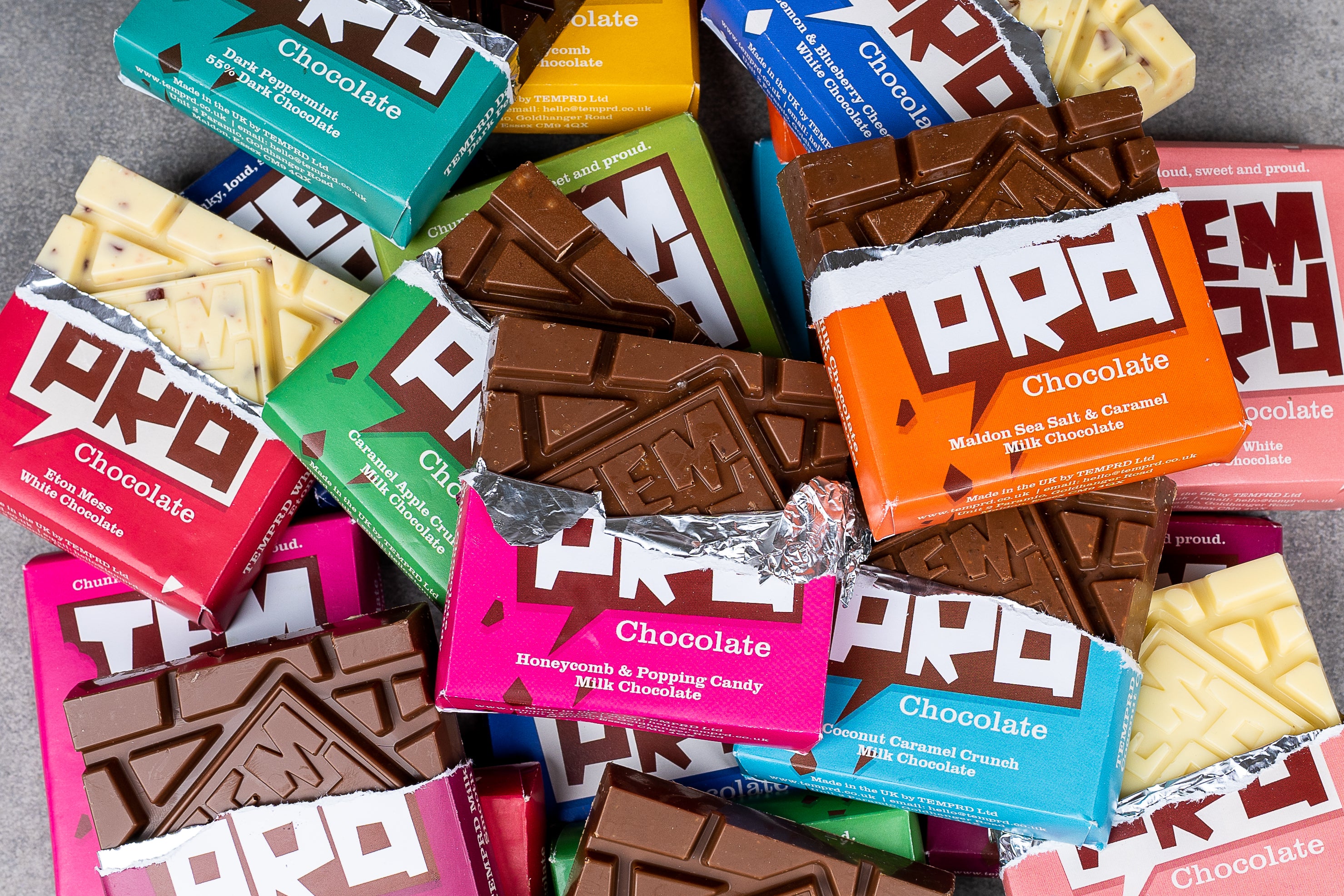 Assorted Temprd chocolate bars in various flavours and packaging.
