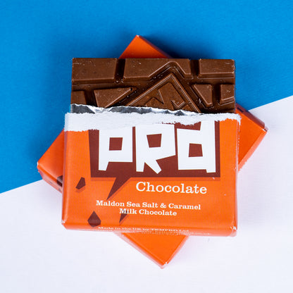 Open Temprd Maldon Sea Salt and Caramel Chocolate bar with visible chocolate pieces on a blue and white background available from Stort Valley Gifting