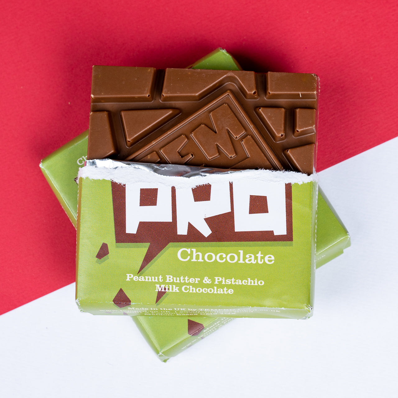 Temprd  Peanut Butter & Pistachio Milk Chocolate on a red and white background available from Stort Valley Gifting